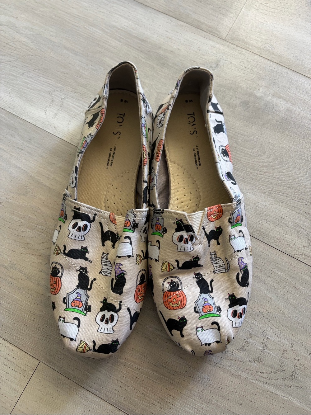 TOMS Women’s Classic Slip-Ons in Light Beige Halloween Print